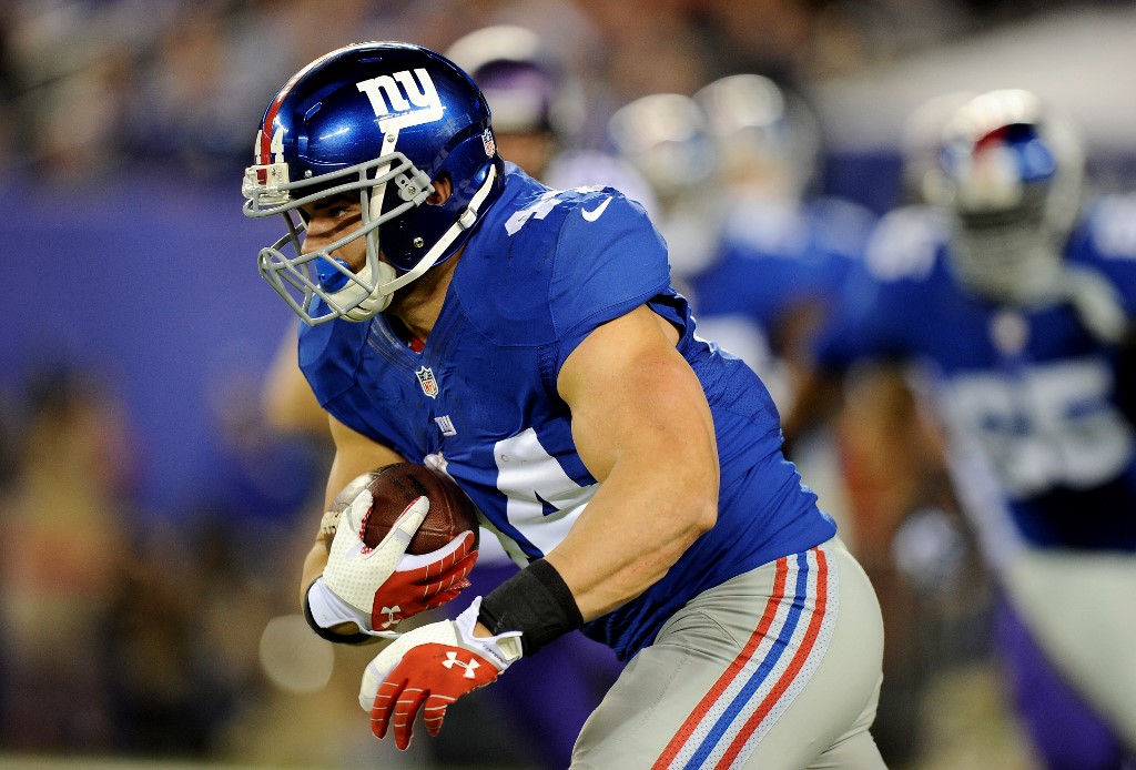 Running back Peyton Hillis #44 of the New York Giants runs with the ball against the Minnesota Vikings during a game at MetLife Stadium on October 21, 2013 in East Rutherford, New Jersey.