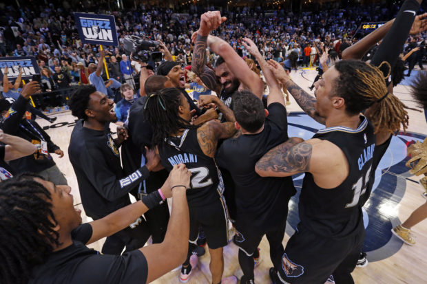 Jan 18, 2023; Memphis, Tennessee, USA; The Memphis Grizzlies celebrate with Memphis Grizzlies center Steven Adams (4) after defeating the Cleveland C