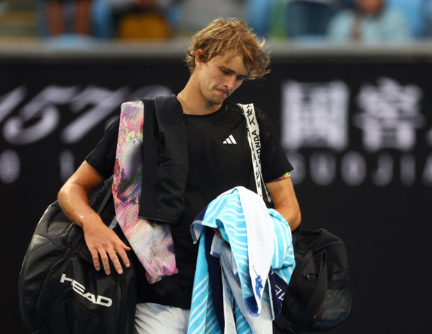 Tennis - Australian Open - Melbourne Park, Melbourne, Australia - January 19, 2023 Germany's Alexander Zverev walks off the court after losing his second round match against Michael Mmoh of the U.S. 