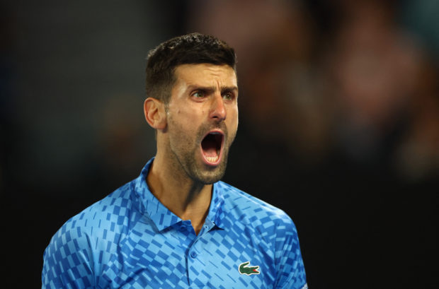 Tennis - Australian Open - Melbourne Park, Melbourne, Australia - January 19, 2023 Serbia's Novak Djokovic reacts during his second round match against France's Enzo Kokad R.