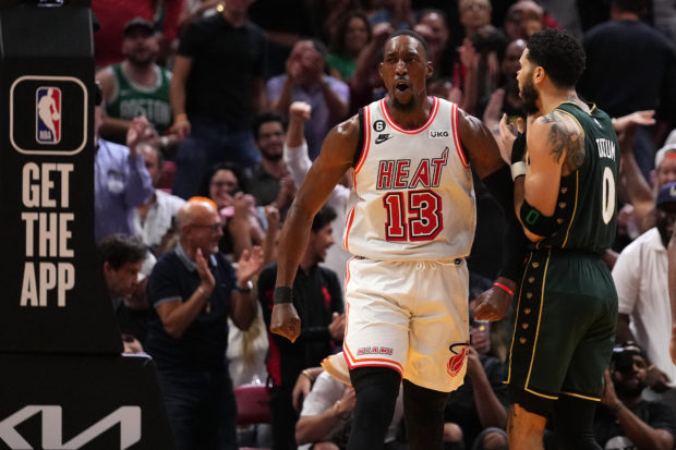 Jan 24, 2023; Miami, Florida, USA; Miami Heat center Bam Adebayo (13) reacts after dunking the ball against the Boston Celtics during the second half at Miami-Dade Arena.