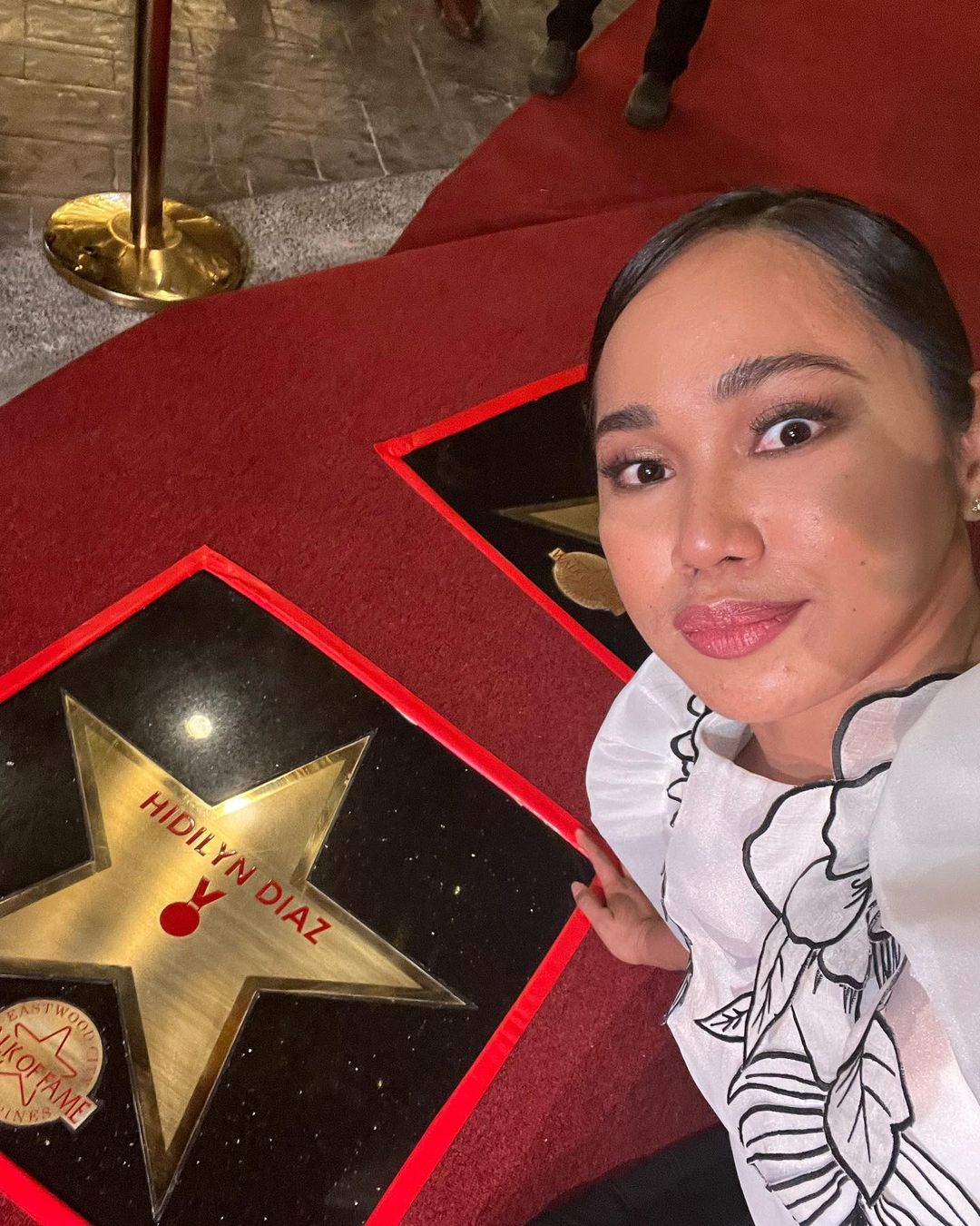 Olympic gold medalist Hidilyn Diaz strikes a pose showing the star with her name on it at the Eastwood Walk of Fame. –HIDILYN DIAZ INSTAGRAM