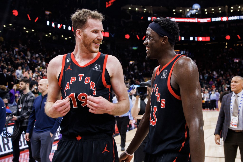  Jakob Poeltl #19 and Pascal Siakam #43 of the Toronto Raptors celebrate after their NBA game against the New Orleans Pelicans at Scotiabank Arena on February 23, 2023 in Toronto, Canada.