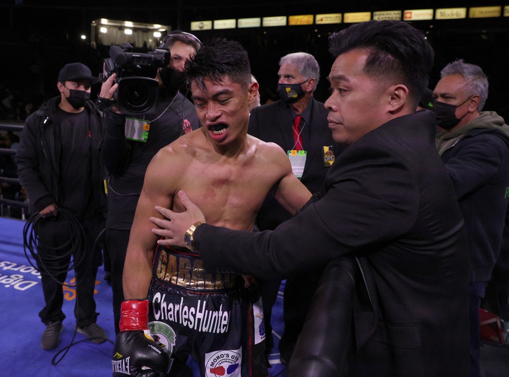 Reymart Gaballo reacts in his corner after a third round knockout loss to Nonito Donaire for the WBC World Bantamweight Championship at Dignity Health Sports Park on December 11, 2021 in Carson, California.   