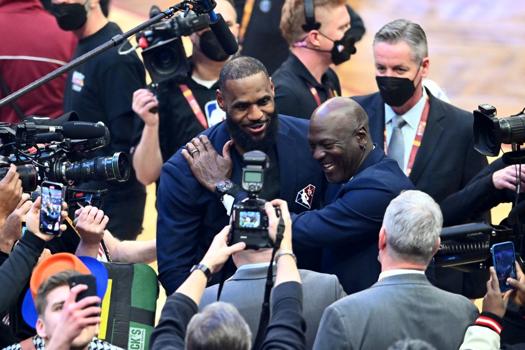  Michael Jordan and LeBron James hug after the presentation of the NBA 75th Anniversary Team during the 2022 NBA All-Star Game at Rocket Mortgage Fieldhouse on February 20, 2022 in Cleveland, Ohio. 