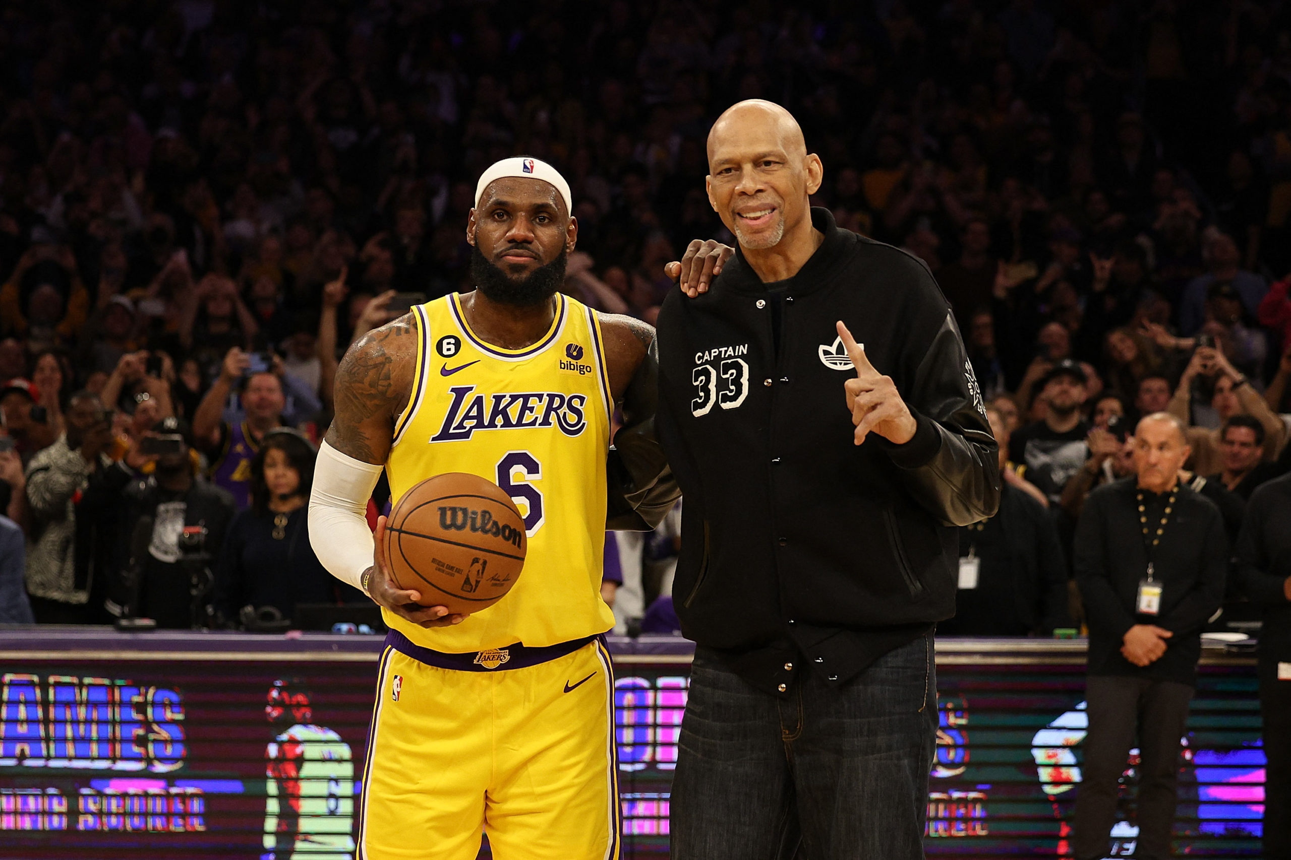 LOS ANGELES, CALIFORNIA - FEBRUARY 07: Kareem Abdul-Jabbar stands on court with LeBron James #6 of the Los Angeles Lakers after James passed Abdul-Jabbar to become the NBA's all-time leading scorer, surpassing Abdul-Jabbar's career total of 38,387 points against the Oklahoma City Thunder at Crypto.com Arena on February 07, 2023 in Los Angeles, California. 