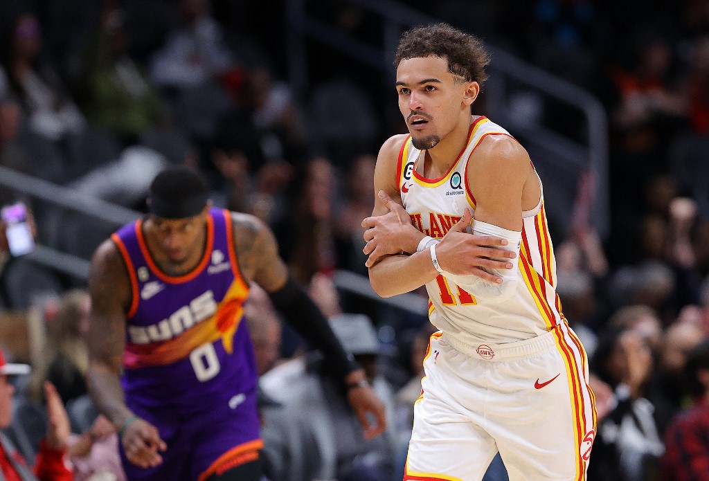  Trae Young #11 of the Atlanta Hawks reacts after hitting a three-point basket against the Phoenix Suns during the fourth quarter at State Farm Arena on February 09, 2023 in Atlanta, Georgia