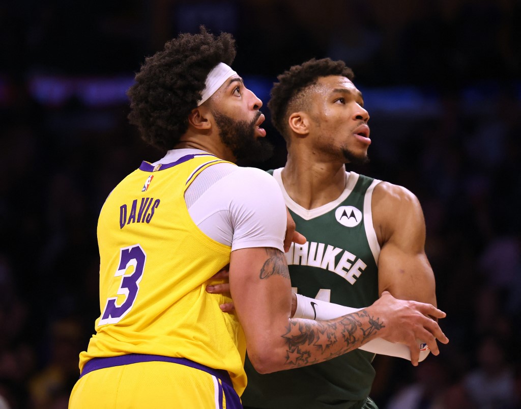 Giannis Antetokounmpo #34 of the Milwaukee Bucks and Anthony Davis #3 of the Los Angeles Lakers look for a rebound during a 115-106 Bucks win at Crypto.com Arena on February 09, 2023 in Los Angeles, California.