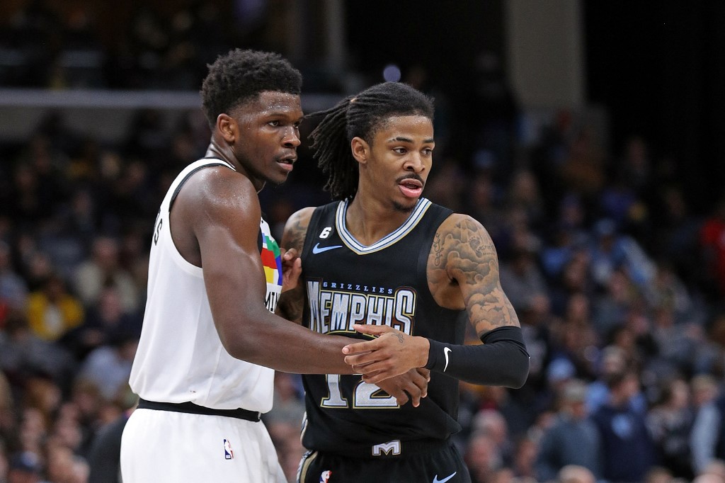 Anthony Edwards #1 of the Minnesota Timberwolves and Ja Morant #12 of the Memphis Grizzlies look on during the second half at FedExForum on February 10, 2023 in Memphis, Tennessee.