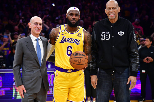 Feb 7, 2023; Los Angeles, California, USA; Los Angeles Lakers forward LeBron James (6) celebrates with NBA commissioner Adam silver and former Lakers player Kareem Abdul-Jabbar after breaking the record for all-time scoring in the NBA during the third quarter against the Oklahoma City Thunder at Crypto.com Arena. / Gary A. Vasquez-USA TODAY Sports