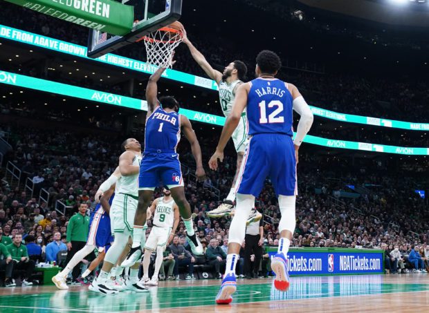 Feb 8, 2023; Boston, Massachusetts, USA; Boston Celtics forward Jayson Tatum (0) blocks the shot of Philadelphia 76ers guard James Harden (1) in the second half at TD Garden. 