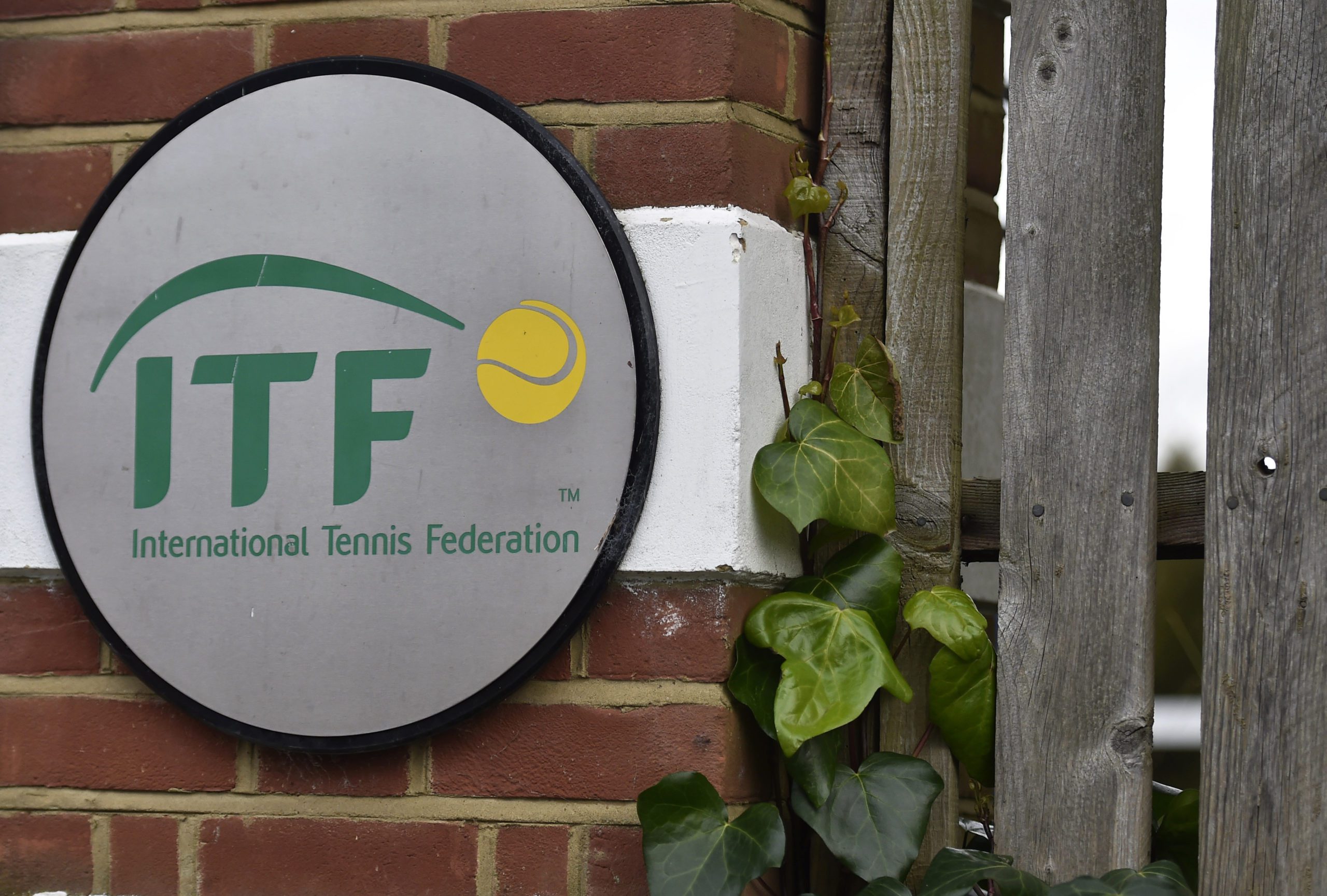 FILE PHOTO: A logo is seen at the entrance to the International Tennis Federation headquarters, where the Tennis Integrity Unit is based, in London, Britain January 18, 2016. 