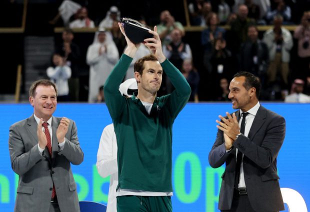 Tennis - ATP 250 - Qatar Open - Khalifa International Tennis and Squash Complex, Doha, Qatar - February 25, 2023 Britain's Andy Murray is pictured with the runners-up trophy after losing his final match against Russia's Daniil Medvedev