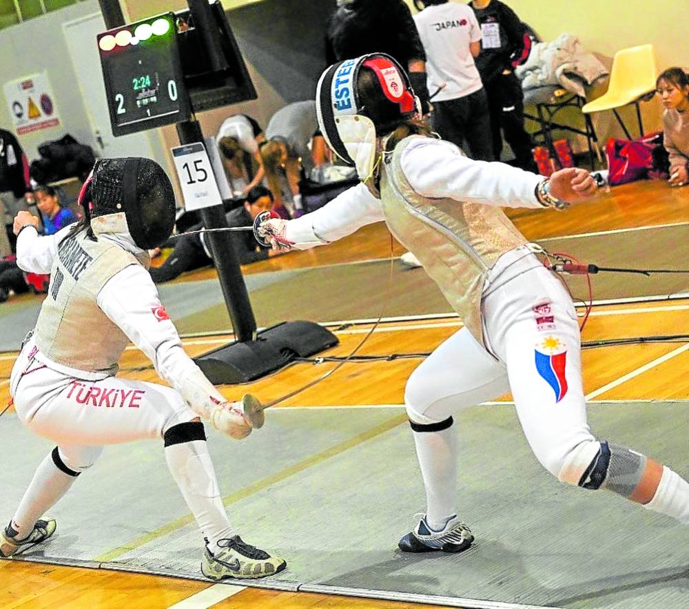 Maxine Esteban (right) in action in France. CONTRIBUTED PHOTO/AUGUSTO BIZZI