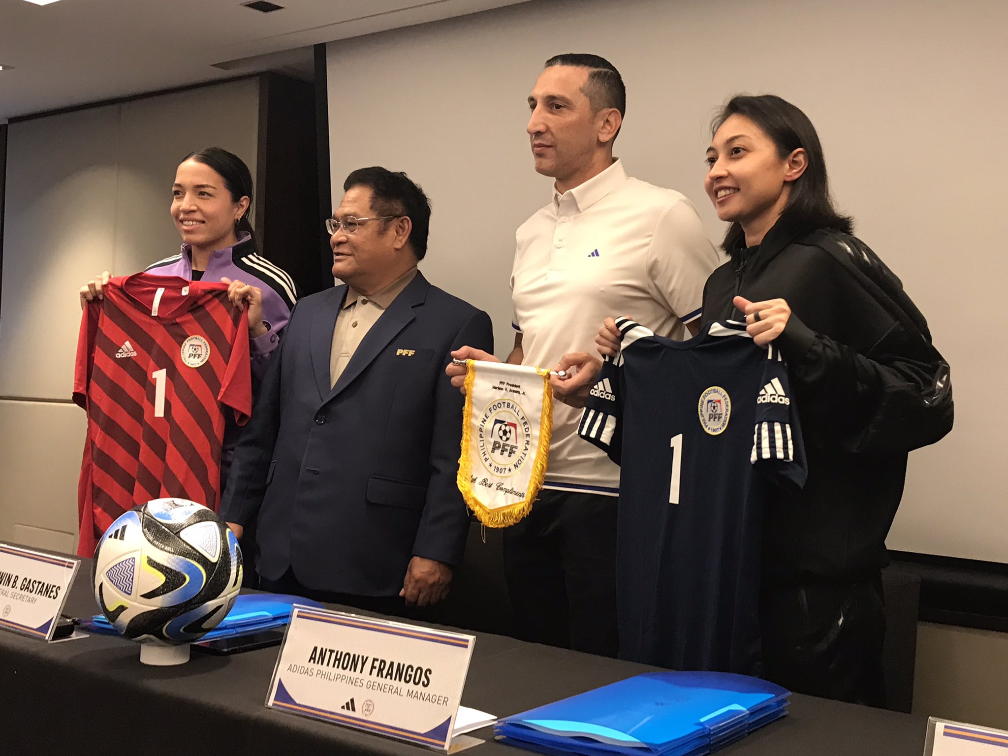 Filipinas members Hali Long and Inna Palacios show the women's national football kits during the signing ceremony on Thursday. –JONAS TERRADO