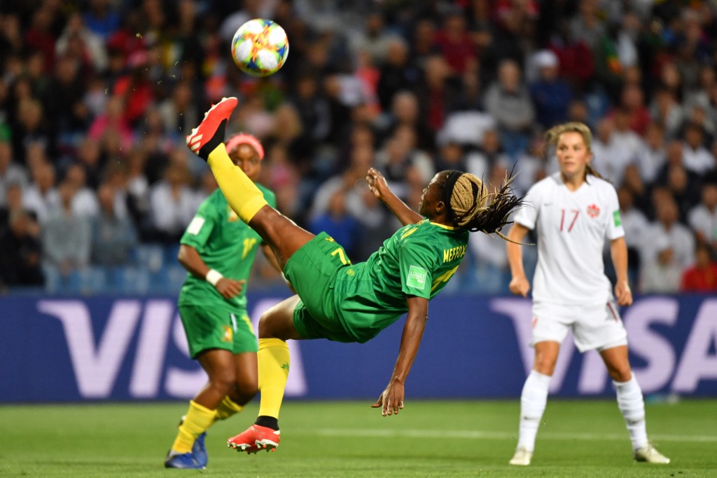 Cameroon's defender Claudine Meffometou kicks the ball during the France 2019 Women's World Cup Group E football match between Canada and Cameroon, on June 10, 2019, at the Mosson Stadium in Montpellier, southern France. (Photo by Pascal GUYOT / AFP)