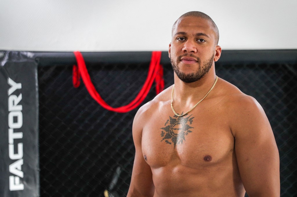 (FILES) In this file photo taken September 14, 2021, French MMA heavyweight athlete Ciryl Gane poses in a Paris gym.  - Gane is about to rematch with MMA legend Jon Jones to compete for the UFC heavyweight title.