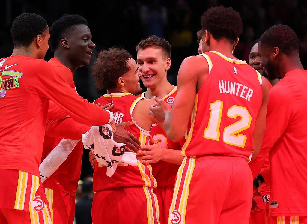  Trae Young #11 of the Atlanta Hawks reacts after hitting the game-winning shot as time expires against the Brooklyn Nets at State Farm Arena on February 26, 2023 in Atlanta, Georgia. 
