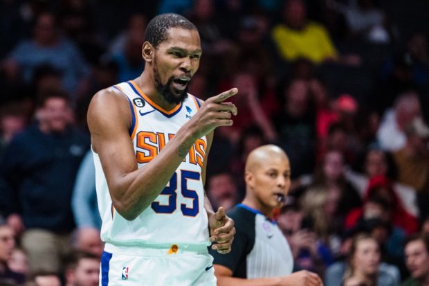 Kevin Durant #35 of the Phoenix Suns reacts in the second quarter during their game against the Charlotte Hornets at Spectrum Center on March 01, 2023 in Charlotte, North Carolina.