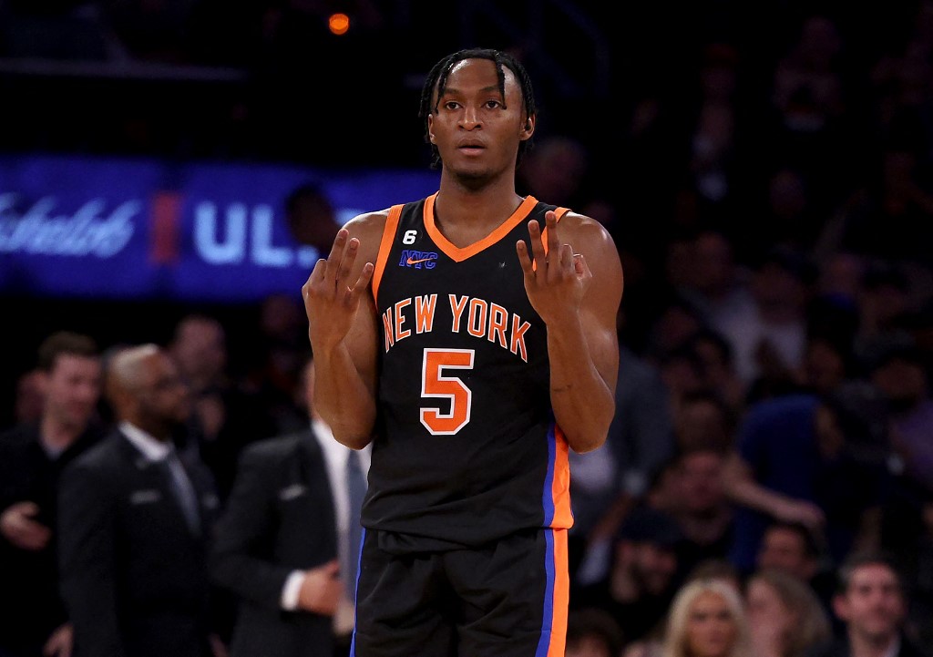 Immanuel Quickley #5 of the New York Knicks celebrates teammate Jalen Brunson's three point shot late in the fourth quarter against the Brooklyn Nets at Madison Square Garden on March 01, 2023 in New York City. The New York Knicks defeated the Brooklyn Nets 149-118.