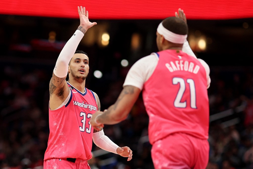 Kyle Kuzma #33 of the Washington Wizards and Daniel Gafford #21 celebrate against the Toronto Raptors during the second half at Capital One Arena on March 2, 2023 in Washington, DC.