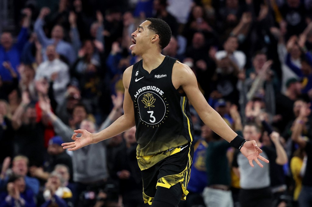  Jordan Poole #3 of the Golden State Warriors reacts after making a three-point basket against the LA Clippers at Chase Center on March 02, 2023 in San Francisco, California. 