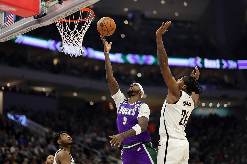 Bobby Portis #9 of the Milwaukee Bucks dunks against Day'Ron Sharpe #20 of the Brooklyn Nets during the first half of the game at the Fiserv Forum on March 9, 2023 in Milwaukee, Wisconsin.