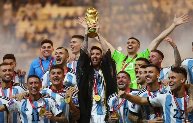 FILE PHOTO: Soccer Football - FIFA World Cup Qatar 2022 - Final - Argentina v France - Lusail Stadium, Lusail, Qatar - December 18, 2022 Argentina's Lionel Messi lifts the World Cup trophy alongside teammates as they celebrate winning the World Cup  