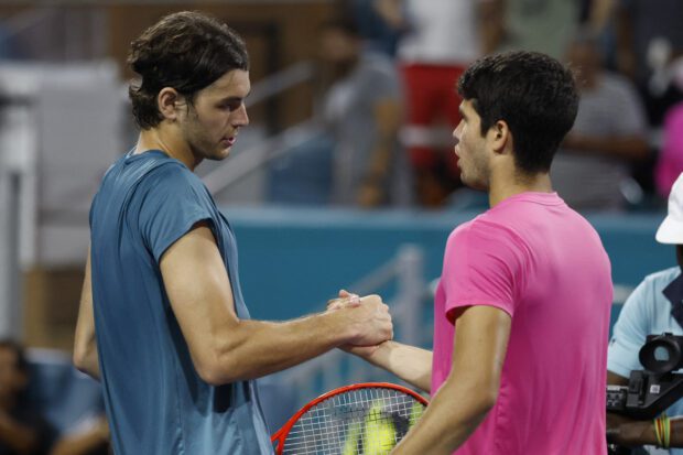 Mar 30, 2023; Miami, Florida, US; Carlos Alcaraz (ESP) (R) shakes hands with Taylor Fritz (USA) (L) after their men's singles quarterfinal on day eleven of the Miami Open at Hard Rock Stadium. Mandatory Credit: Geoff Burke-USA TODAY Sports
