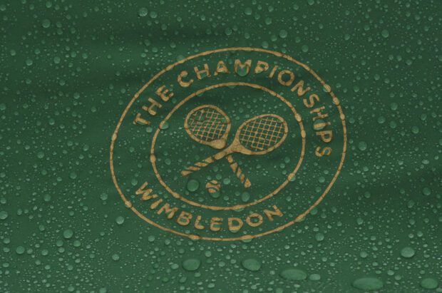 FILE PHOTO: Britain Tennis - Wimbledon - All England Lawn Tennis & Croquet Club, Wimbledon, England - 28/6/16  A general view of the Wimbledon logo in the rain REUTERS/Toby Melville
