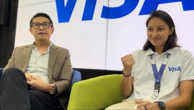 Inna Palacios (right) gestures as Visa country manager for Philippines and Guam Jeff Navarro makes a point. —FRANCIS T.J. OCHOA
