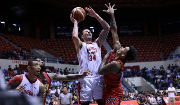 Ginebra's Christian Standhardinger against San Miguel defenders in game 1 of the PBA semifinals. –PBA PHOTO