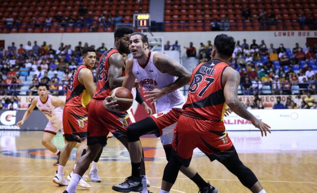 Ginebra's Christian Standhardinger against San Miguel defenders in game 1 of the PBA semifinals. –PBA PHOTO