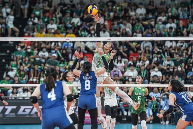 Fifi Sharma (attacking) and the Lady Spikers were a tad quicker than the Lady Bulldogs in another straight sets victory. —UAAP PHOTO