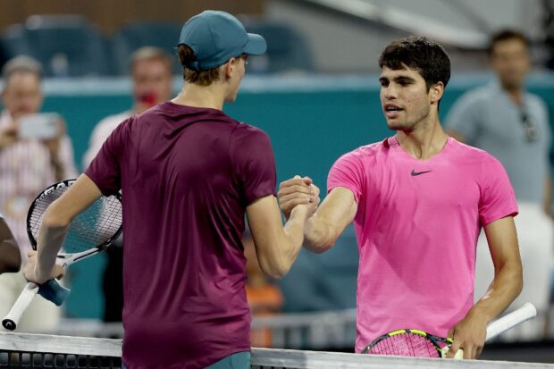 Jannik Sinner of Italy is congratulated by Carlos Alcaraz of Spain after their match during the semifinals of the Miami Open at Hard Rock Stadium on March 31, 2023 in Miami Gardens, Florida. 