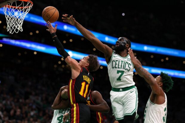  Jaylen Brown #7 of the Boston Celtics defends a shot from Trae Young #11 of the Atlanta Hawks during the second quarter of Game Two of the Eastern Conference First Round Playoffs between the Boston Celtics and the Atlanta Hawks at TD Garden on April 18, 2023 in Boston, Massachusetts