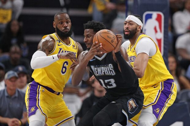 Jaren Jackson Jr. #13 of the Memphis Grizzlies handles the ball during the first half against LeBron James #6 of the Los Angeles Lakers and Anthony Davis #3 of the Los Angeles Lakers during Game Two of the Western Conference First Round Playoffs at FedExForum on April 16, 2023 at Memphis,