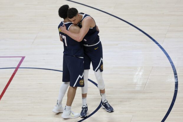 Jamal Murray #27 and Michael Porter Jr.1 of the Denver Nuggets celebrate their win in the final seconds against the Minnesota Timberwolves in the fourth quarter during Round 1 Game 2 of the NBA Playoffs at Ball Arena on April 19, 2023 in Denver, Colorado.