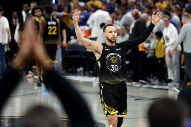  Stephen Curry #30 of the Golden State Warriors reacts after he made a basket at the end of the first half against the Sacramento Kings during Game Three of the Western Conference First Round Playoffs at Chase Center on April 20, 2023 in San Francisco, California. 