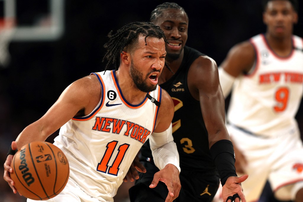 Jalen Brunson #11 of the New York Knicks drives to the basket as Caris LeVert #3 of the Cleveland Cavaliers defends during game three of the Eastern Conference playoffs at Madison Square Garden on April 21, 2023 in New York City. 