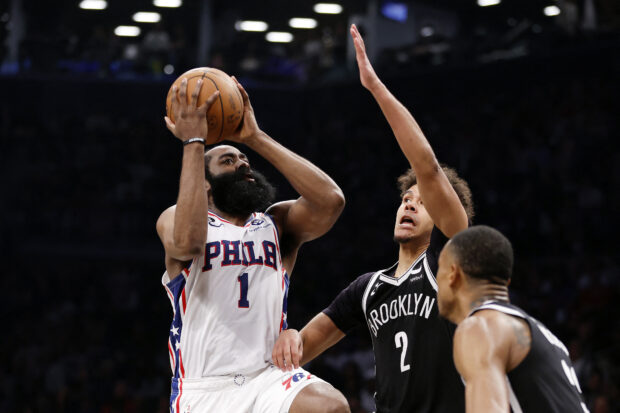 James Harden #1 of the Philadelphia 76ers goes to the basket as Cameron Johnson #2 of the Brooklyn Nets defends during the second half of Game Four of the Eastern Conference First Round Playoffs at Barclays Center on April 22, 2023 in the Brooklyn borough of New York City. The 76ers won 96-88. NOTE TO USER: User expressly acknowledges and agrees that, by downloading and or using this photograp