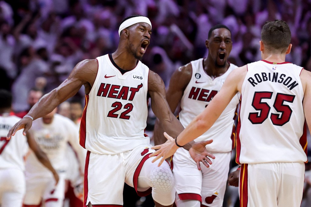   Jimmy Butler #22, Bam Adebayo #13 and Duncan Robinson #55 of the Miami Heat celebrate during the fourth quarterback against the Milwaukee Bucks in Game Four of the Eastern Conference First Round Playoffs at Kaseya Center on April 24, 2023 in Miami, Florida.