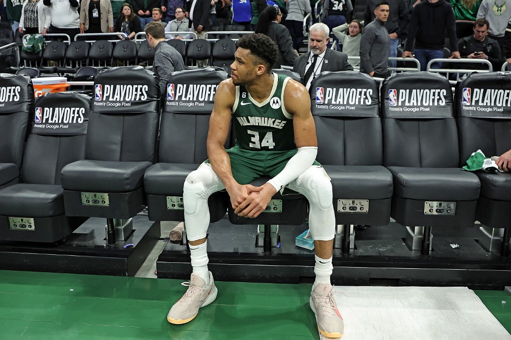 Giannis Antetokounmpo #34 of the Milwaukee Bucks sits on the bench after losing Game 5 of the Eastern Conference First Round Playoffs against the Miami Heat in overtime at Fisher Forum on April 26, 2023 in Milwaukee, Wisconsin.