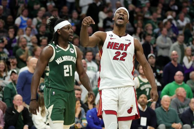 Jimmy Butler #22 of the Miami Heat and Jrue Holiday #21 of the Milwaukee Bucks exchange words during the second half of Game 5 of the Eastern Conference First Round Playoffs at Fiserv Forum on April 26, 2023 in Milwaukee, Wisconsin.