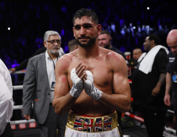 FILE PHOTO: Boxing - Amir Khan v Kell Brook - AO Arena, Manchester, Britain - February 19, 2022 Amir Khan looks dejected after losing the fight Action Images via Reuters/Andrew Couldridge