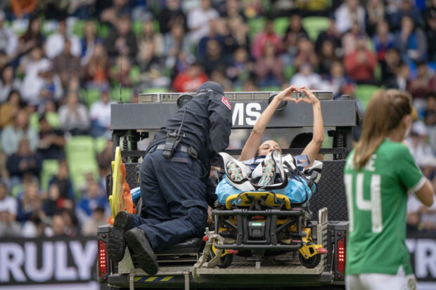 FILE PHOTO: Apr 8, 2023; Austin, Texas, USA; U.S. Women's National Team forward Mallory Swanson (9) is escorted off field by medical personnel during the first half in a match against the Republic of Ireland Women's National Team at Q2 Stadium. Mandatory Credit: Dustin Safranek-USA TODAY Sports