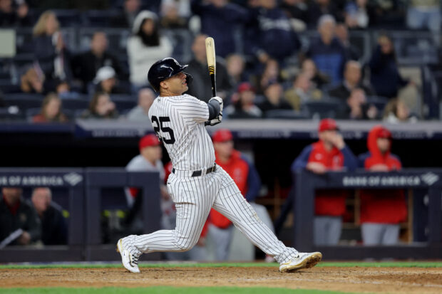  New York Yankees second baseman Gleyber Torres (25) follows through on a walkoff sacrifice fly during the tenth inning against the Los Angeles Angels at Yankee Stadium. 
