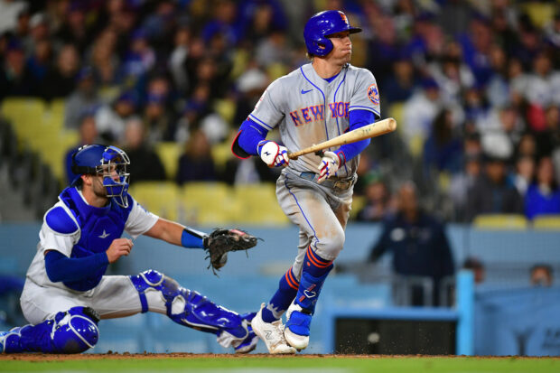 Apr 17, 2023; Los Angeles, California, USA; New York Mets New York Mets center fielder Brandon Nimmo (9) hits a double against the Los Angeles Dodgers during the eighth inning at Dodger Stadium. 