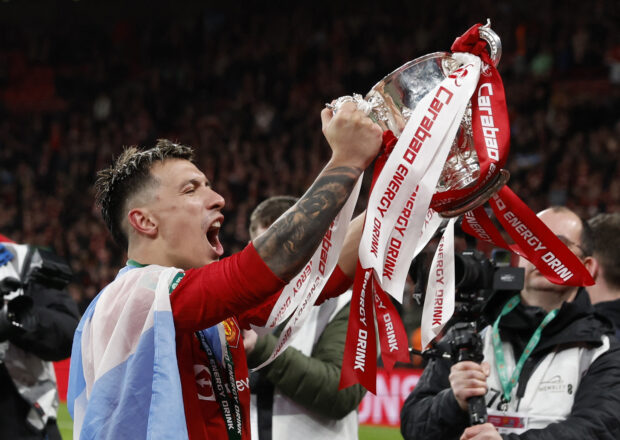 Soccer Football - Carabao Cup - Final - Manchester United v Newcastle United - Wembley Stadium, London, Britain - February 26, 2023  Manchester United's Lisandro Martinez celebrates with the trophy after winning the Carabao Cup final Action Images via Reuters/Andrew Couldridge