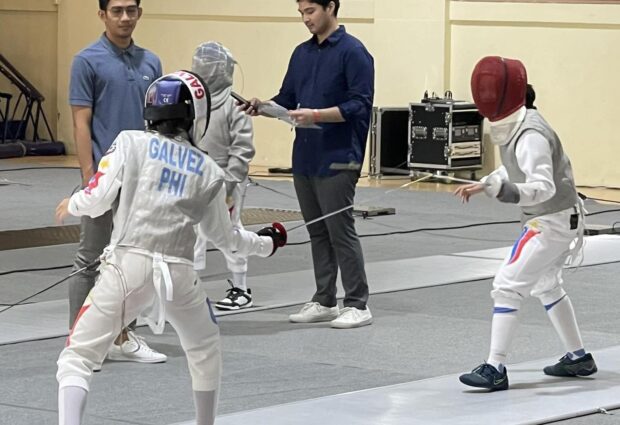 Willa Galvez, left, and Hagia del Castillo face off in the Under-15 women’s foil category in the Admirals Fencing Invitational 2023 on Saturday at The Palms Country Club in Alabang, Muntinlupa City. –CONTRIBUTED PHOTO